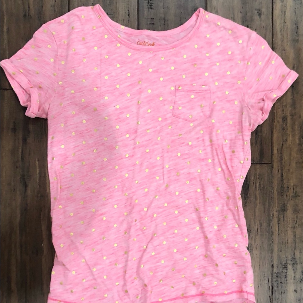 Pink child’s shirt with gold polka dots